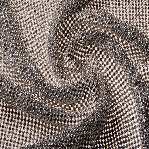 clothing fabric material containing metal|fabric with metallic accents.